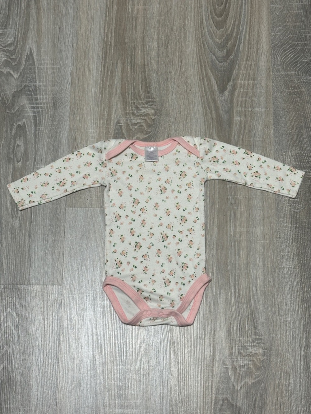 Long-Sleeve Floral Baby Bodysuit with Pink Trim